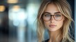 © Рудой Максим - Young woman with glasses poses indoors, showcasing her natural beauty and stylish look in soft lighting during the day