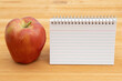 © Karen Roach - Back to School with a blank notebook and apple on a desk