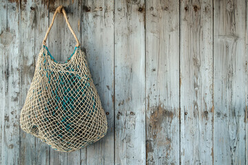 A weathered wooden wall with a worn fishing net hanging, a silent reminder of the sea's bounty.