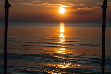 Sunset or sunrise moment over the ocean with sun touching the horizon line on the water - romantic and touristic concept for travel vacation background Generative AI