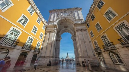 Wall Mural - Rua Augusta Arch (Arco da Rua Augusta) timelapse hyperlapse on Praca do Comercio. Historic stone art monument with clock, ornaments and old tourist landmark attraction in Lisbon, Portugal, Europe.