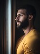 © senyumanmu - Thoughtful Man Looking Out Window  Portrait of Man with Beard  Pensive Expression