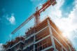 © kenkuza - Industrial construction crane with blue sky background at building site