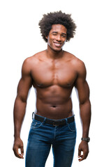 Wall Mural - afro american shirtless man showing nude body over isolated background winking looking at the camera