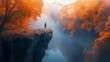 © Premium_art - Person standing on cliff edge amidst vibrant autumn forest and mist.