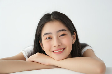 Beautiful young Asian woman in studio on white background. Beauty, perfect skin concept. Copy space