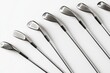 © Georgii - Golf Clubs Set Against Clean White Surface