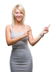 Young beautiful blonde woman over isolated background smiling and looking at the camera pointing with two hands and fingers to the side.