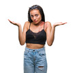 © Krakenimages.com - Young braided hair african american with pigmentation blemish birth mark over isolated background clueless and confused expression with arms and hands raised. Doubt concept.