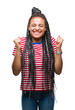 © Krakenimages.com - Young braided hair african american girl over isolated background excited for success with arms raised celebrating victory smiling. Winner concept.