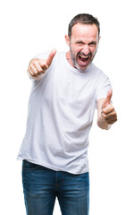 Wall Mural - Middle age hoary senior man wearing white t-shirt over isolated background approving doing positive gesture with hand, thumbs up smiling and happy for success. Looking at the camera, winner gesture.