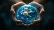 © Naphol - A captivating image of hands gently cradling a glowing Earth, symbolizing care and stewardship of our planet.