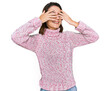 © Krakenimages.com - Young caucasian girl wearing wool winter sweater covering eyes with hands smiling cheerful and funny. blind concept.
