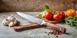 © Neungruedee - Stainless steel knife with wood handle next to ingredients on table against concrete background , kitchen, cooking
