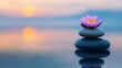 © Thanate - Pink Water Lily Flower on Stacked Stones at Sunset.