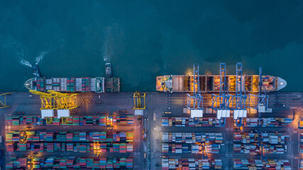 Aerial view container cargo ship  at commercial sea port, Global business logistic import export transportation international by container cargo ship, Container cargo ship freight shipping at night.