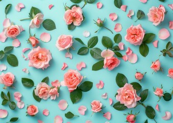 Wall Mural - Pink roses arranged on a pastel blue background with green leaves and scattered petals A fresh, vibrant floral composition suitable for various themes