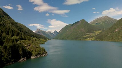 Wall Mural - Explore Fjaerlands Fjord with stunning mountains and crystal clear waters, ideal for outdoor activities like hiking