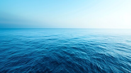 Poster - Blue ocean water with clear sky.