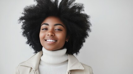 Wall Mural - Portrait of a smiling young woman with afro hair.