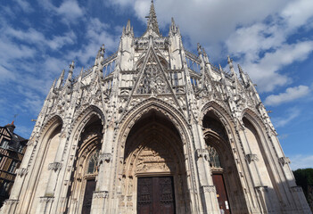 in Rouen, Normandy, the Church of St. Maclovius is an opulent Gothic Catholic church with carved wooden doors from the Renaissance period.