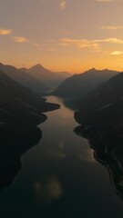 Wall Mural - Breathtaking aerial view of Lake Plansee, nestled in the Tyrolean mountains of Austria during a golden sunset.