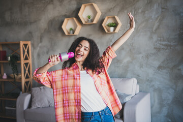 Poster - Photo of shiny cute girl dressed white plaid shirt smiling singing microphone indoors house apartment room