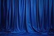 © volga - Elegant blue theater curtain background with luxurious drapery folds