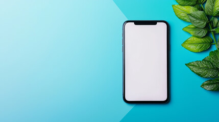 A modern smartphone with a blank screen sits on a blue background with green leaves.
