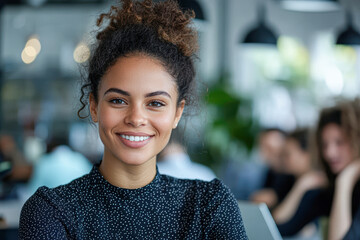 Poster - A woman with a smile on her face is standing in front of a group of people