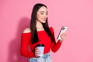 Canvas Print - Portrait of pretty young girl smart phone coffee red top isolated on pink color background