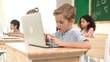 © InfiniteFlow - Caucasian smart child programing software system and learning about coding while multicultural searching about engineering code. Happy boy thinking about engineering prompt by using laptop. Pedagogy.