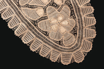 Northeast Brazilian Renaissance lace placemat, isolated on black backgrounds.