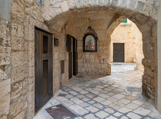 Wall Mural - Polignano a Mare - The old town aisle with the little chapel of St. Anthony of Padua. 