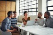 © ThurstanJam/peopleimages.com - Team, laptop or reading in office for architecture, workshop feedback or sharing ideas for design. Pitch, people and computer in startup for project planning, brainstorming or creative productivity