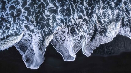 Wall Mural - Aerial View of Waves Crashing on Black Sand Beach