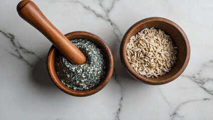 Top view of a stone mortar and pestle on a white background, featuring space for text or design.