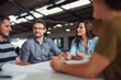 © ThurstanJam/peopleimages.com - People, small business and meeting in office for brainstorming, advice or project management. Team, communication or architecture at table with proposal, feedback or planning for company growth