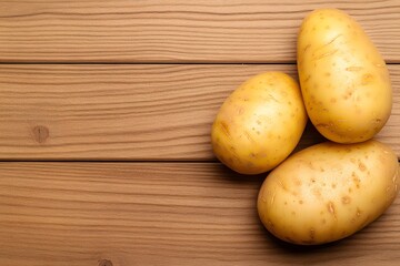 potato on a wooden background, top view