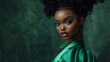 © Maxmilian - A Black woman with an updo hairstyle, wearing green and posing for the cover of magazine