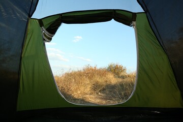 Canvas Print - Beautiful blue sky and grass, view from camping tent