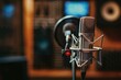 © Fotograf - Studio equipment image featuring a microphone and blurred background