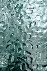 Sticker - A close-up shot of water droplets on a smooth glass surface