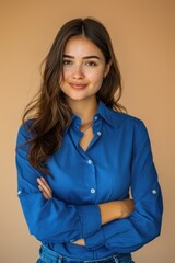 Wall Mural - A woman poses for a photo wearing a blue shirt and possibly other clothing