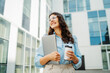© Dusan - Young successful woman is going to work at modern business building