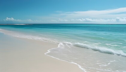 The tranquil beach, white sand beaches meet with blue sea water, and there are slight white clouds on the skyline, creating a dreamy ocean scenery.