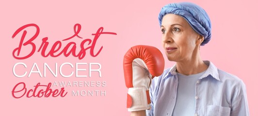 Poster - Mature woman in boxing glove on pink background. Banner for Breast Cancer Awareness Month