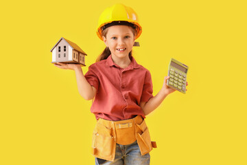 Canvas Print - Cute little architect with house model and calculator on yellow background