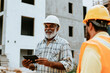 © Nedrofly - Construction supervisor communicates with team on site