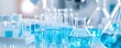 © Phichaphat - Blue Liquid in Test Tubes and Flasks - Scientific Research